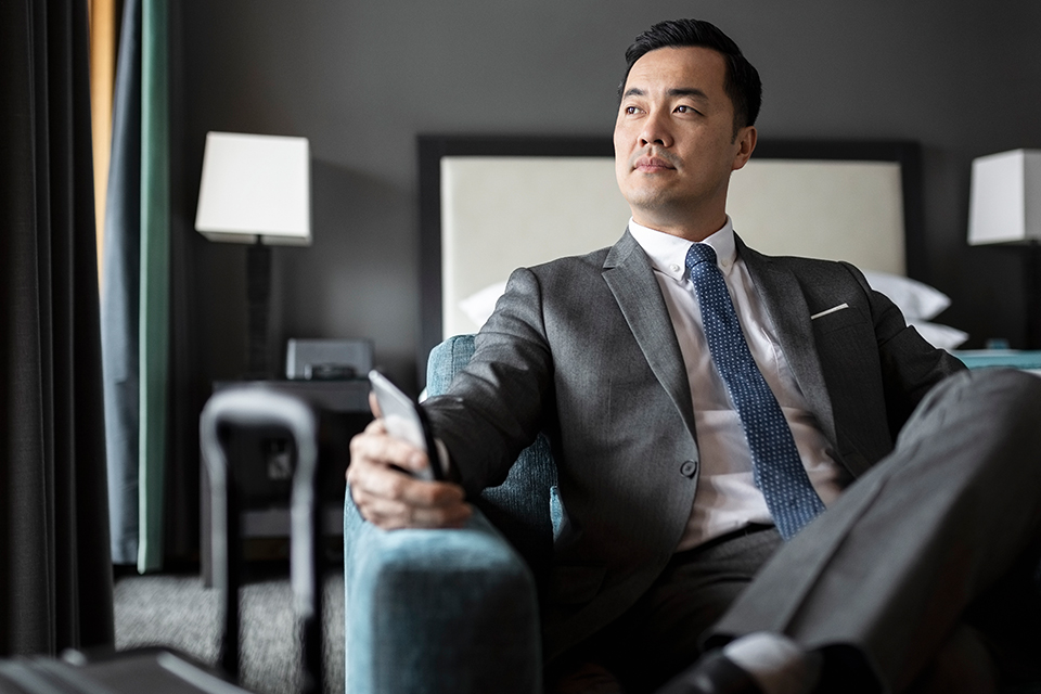 Chief Marketing Officer sitting in a chair and considering the importance of incorporating energy efficiency in his business' brand.