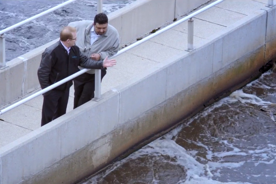 two men overlooking Sudbury wastewater treatment facility
